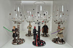 Wine glasses with Star Wars-themed bases featuring figures.