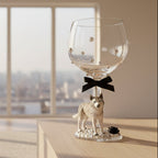 Decorative wine glass with a husky figurine, black bow and pearls.