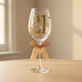 Wine glass with '21' and a bow on a white background