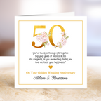 50th wedding anniversary card with floral design and personalized text.