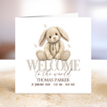 Newborn announcement card with a rabbit illustration and text on a white background.
